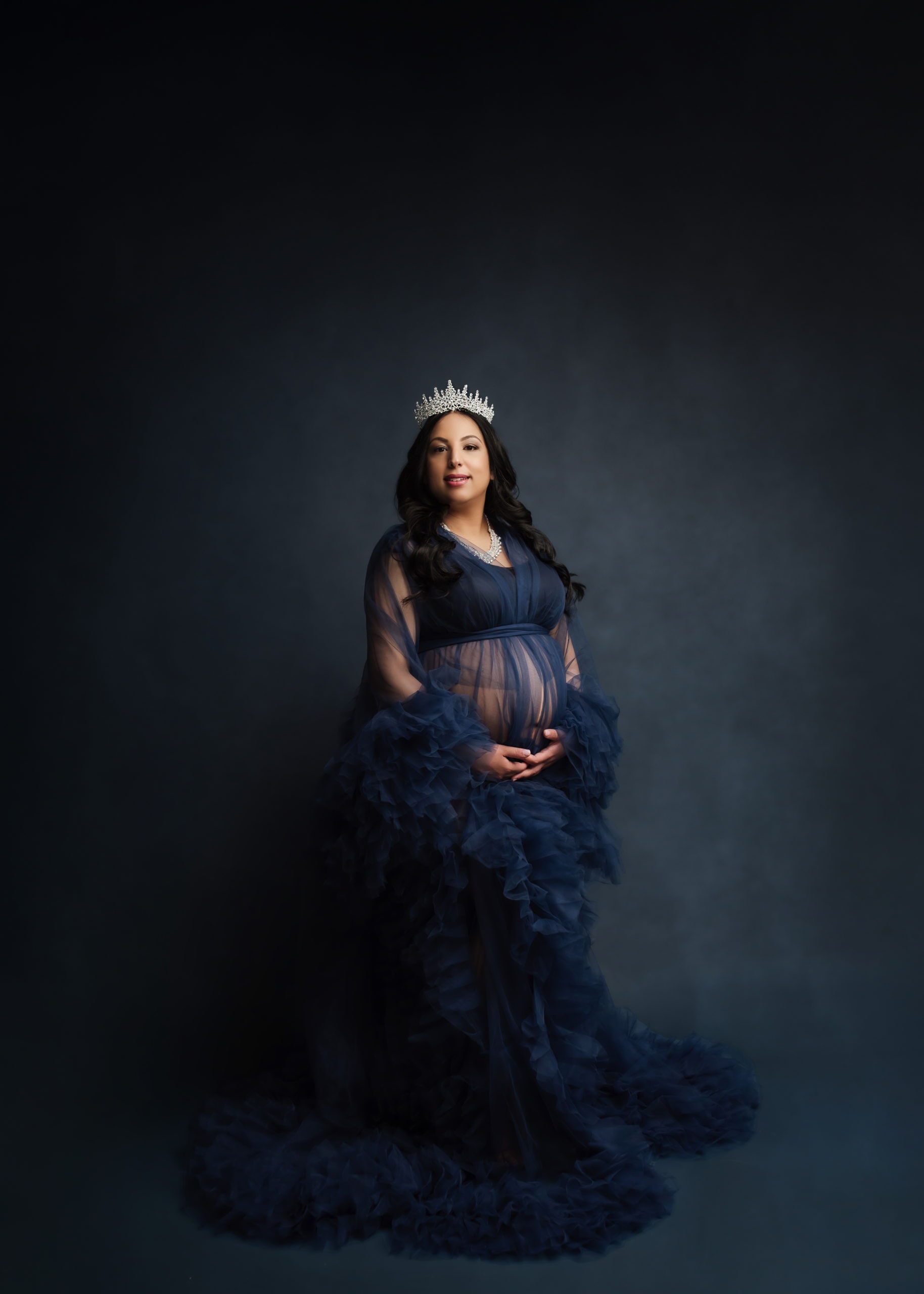 Elegant Pregnant Mom wearing a blue gown for her maternity photography session in Prince George