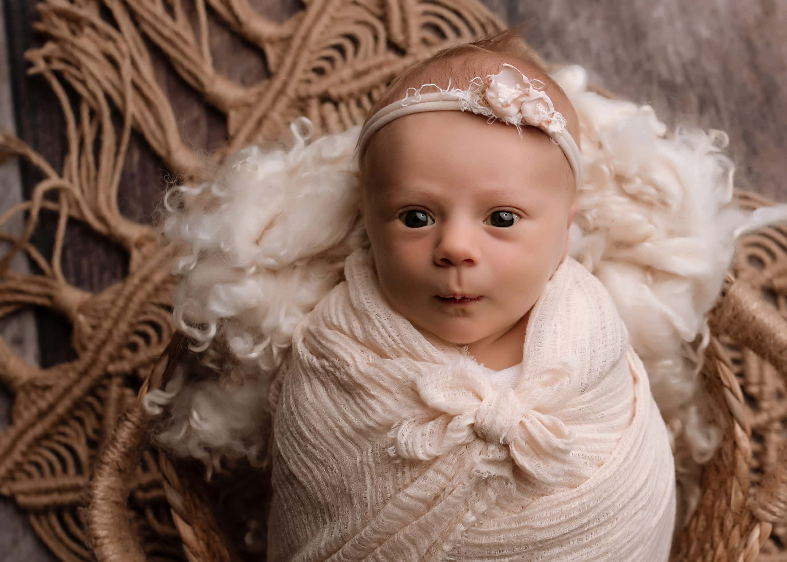wide awake starring at the photographer, professional newborn photography in Prince George